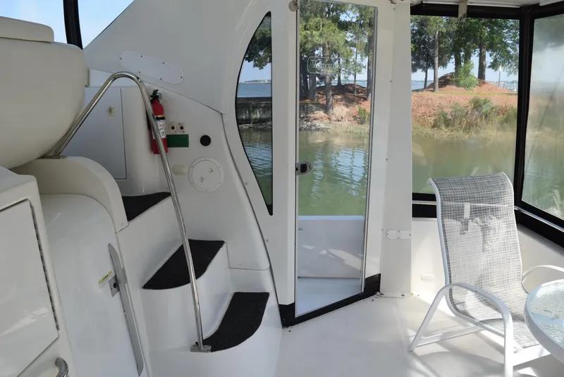 Slide: The Image of Interior view of 2002 Carver 444 Cockpit Motoryacht with steps and seating area. - 8