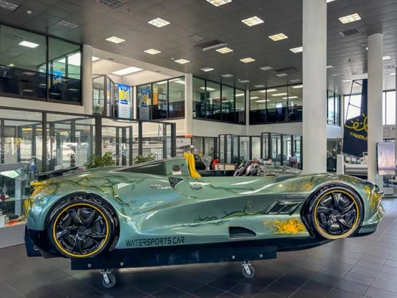 The Image of 2023 Watersports Car Series X on display in a modern showroom. - 0
