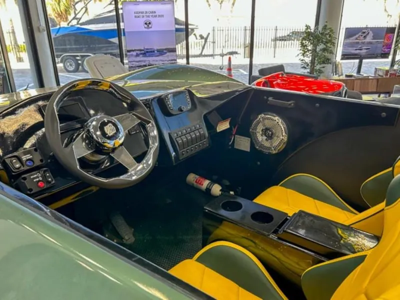 Slide: The Image of Interior of 2023 Watersports Car Series X with yellow seats and modern dashboard. - 3
