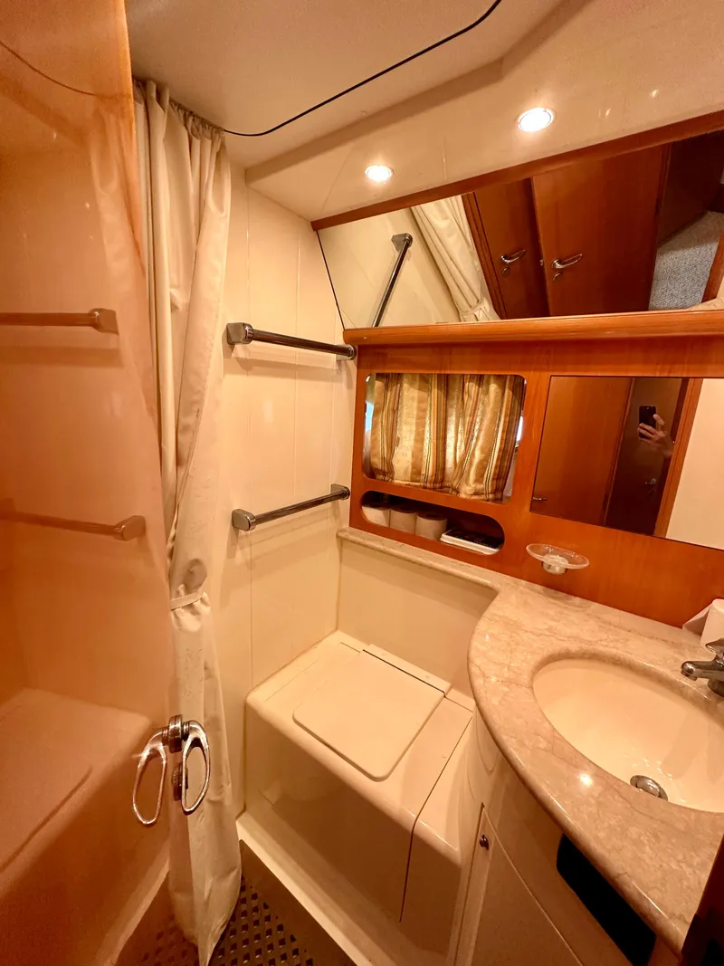 Slide: The Image of Luxurious bathroom in a 2001 Uniesse 42 Open yacht with shower and vanity. - 12