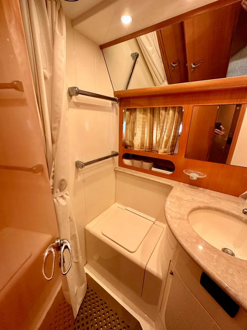 Slide: The Image of Bathroom interior of a 2001 Uniesse 42 Open yacht with shower and sink. - 15