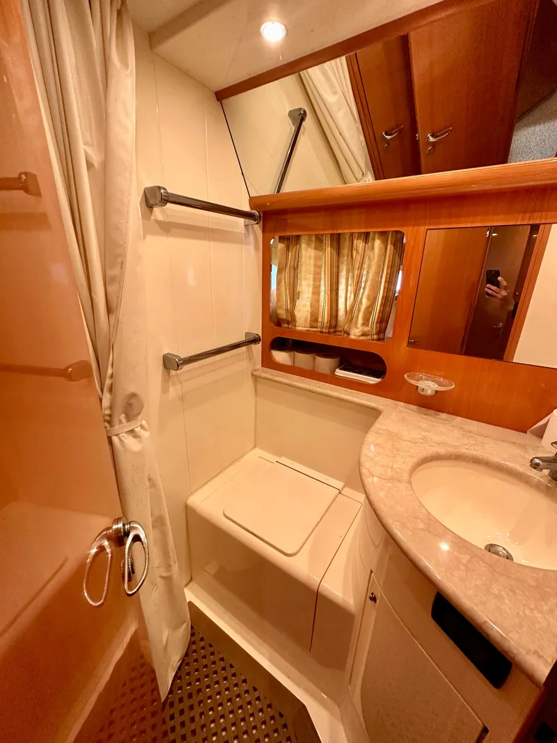 Slide: The Image of Bathroom interior of a 2001 Uniesse 42 Open yacht with shower and sink. - 18
