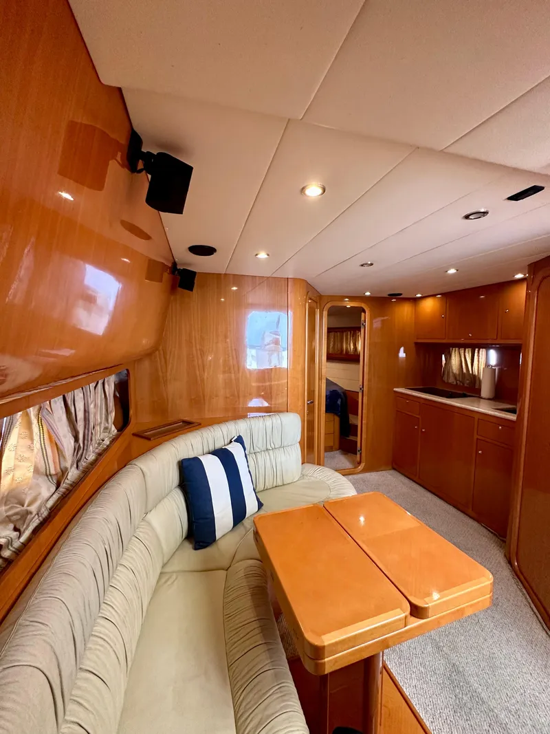 Slide: The Image of Luxurious interior of 2001 Uniesse 42 Open yacht with cozy seating and modern amenities. - 24