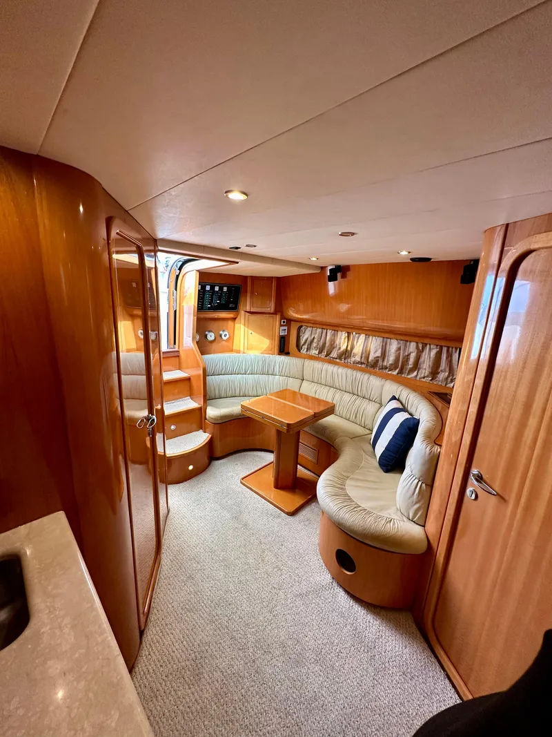Slide: The Image of Interior of 2001 Uniesse 42 Open yacht with cozy seating area. - 25