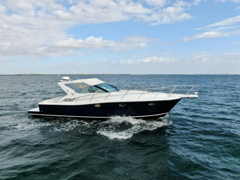 Slide: The Image of 2001 Uniesse 42 Open yacht cruising on open water. - 3