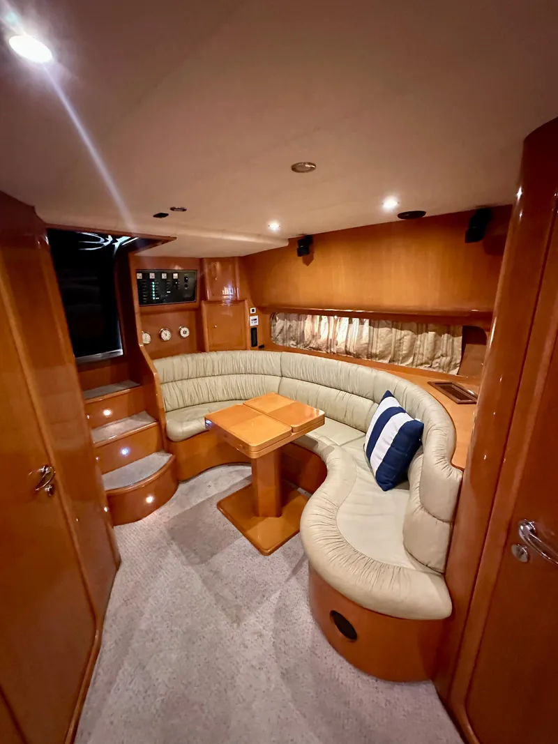 Slide: The Image of Interior of 2001 Uniesse 42 Open yacht with cozy seating and wooden finishes. - 31