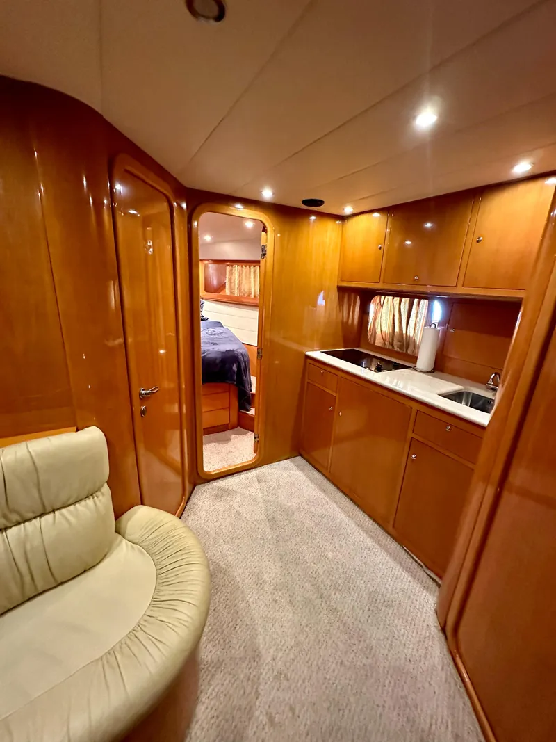 Slide: The Image of Interior of 2001 Uniesse 42 Open yacht with wood cabinetry and modern amenities. - 32