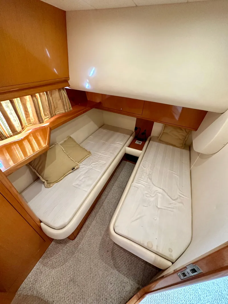Slide: The Image of 2001 Uniesse 42 Open cabin with twin beds and wooden interior. - 37