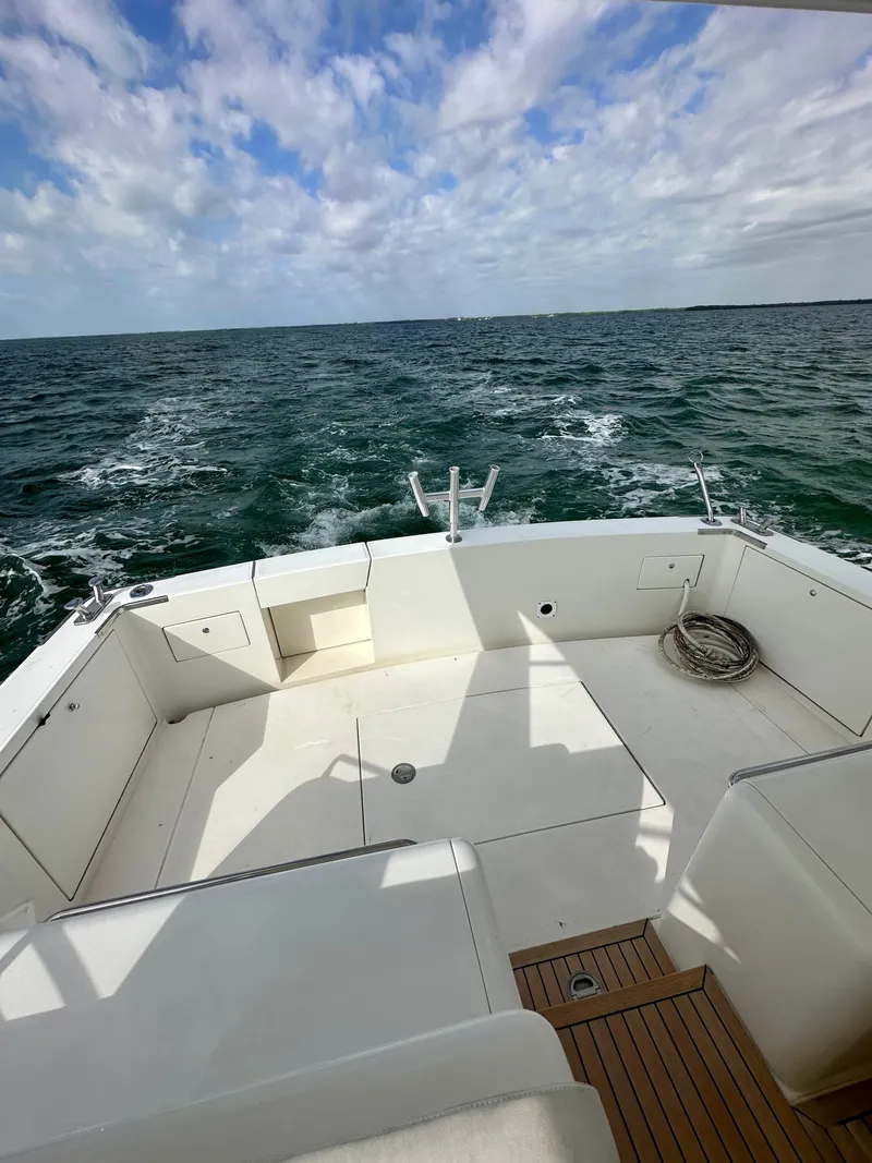 Slide: The Image of Uniesse 42 Open 2001 model boat deck with ocean view and cloudy sky. - 41