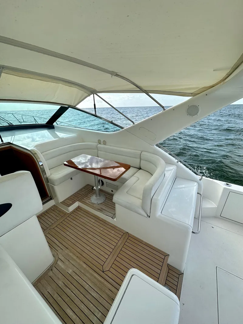 Slide: The Image of Luxurious 2001 Uniesse 42 Open yacht with spacious seating and ocean view. - 42