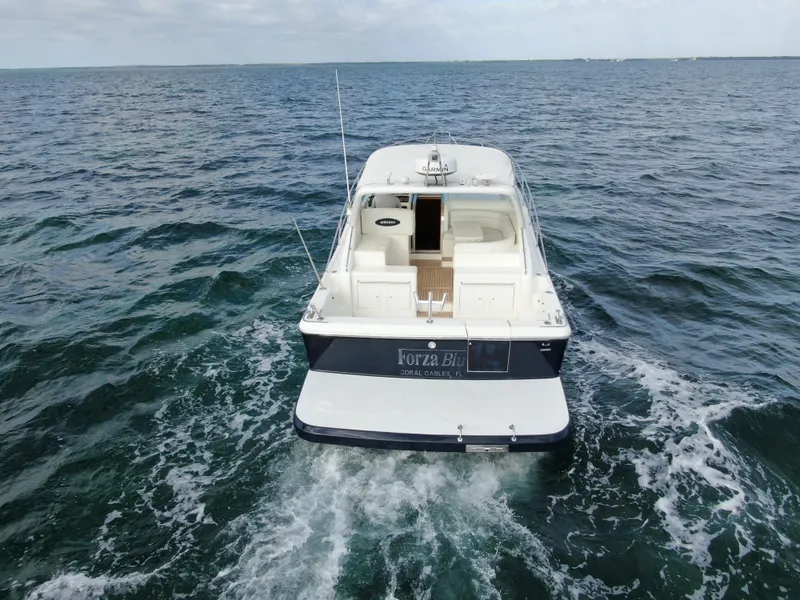 Slide: The Image of 2001 Uniesse 42 Open yacht cruising on open water. - 6