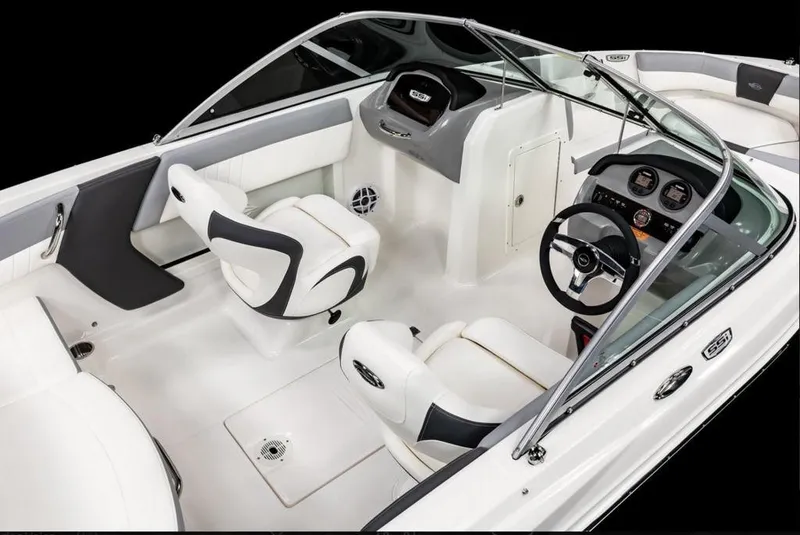 Slide: The Image of 2024 Chaparral 19 SSI O.B. boat interior with white and black seating. - 2