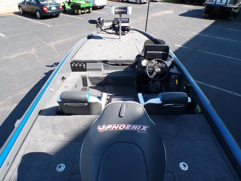 Slide: The Image of 2023 Phoenix 920 Elite fishing boat interior with steering console and seating. - 13