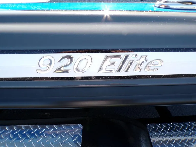 Slide: The Image of 2023 Phoenix 920 Elite boat model emblem on metallic surface - 14