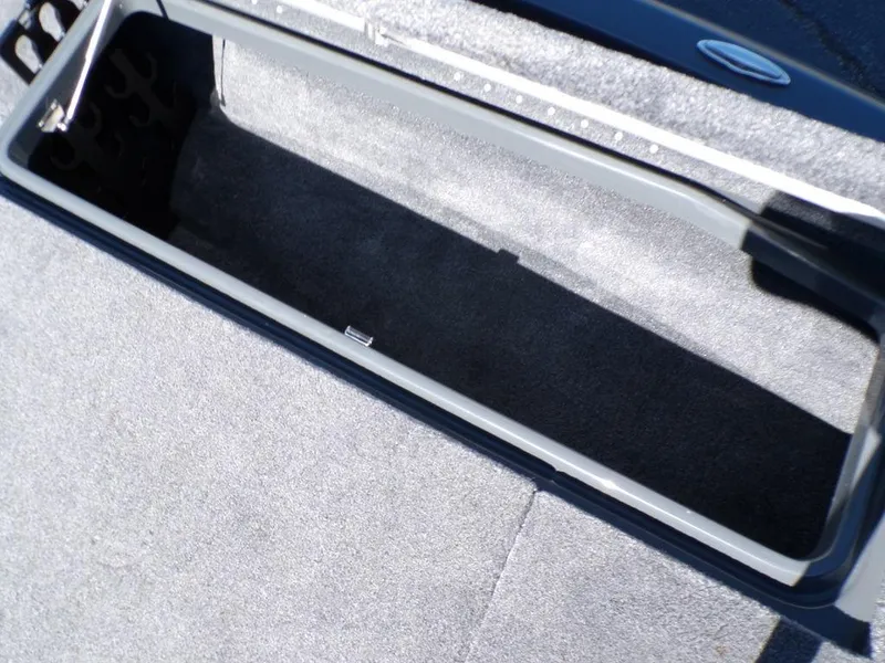Slide: The Image of Open storage compartment in 2023 Phoenix 920 Elite boat. - 26