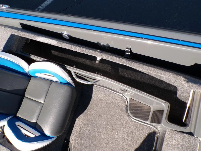 Slide: The Image of 2023 Phoenix 920 Elite boat interior with seating and storage compartment. - 28