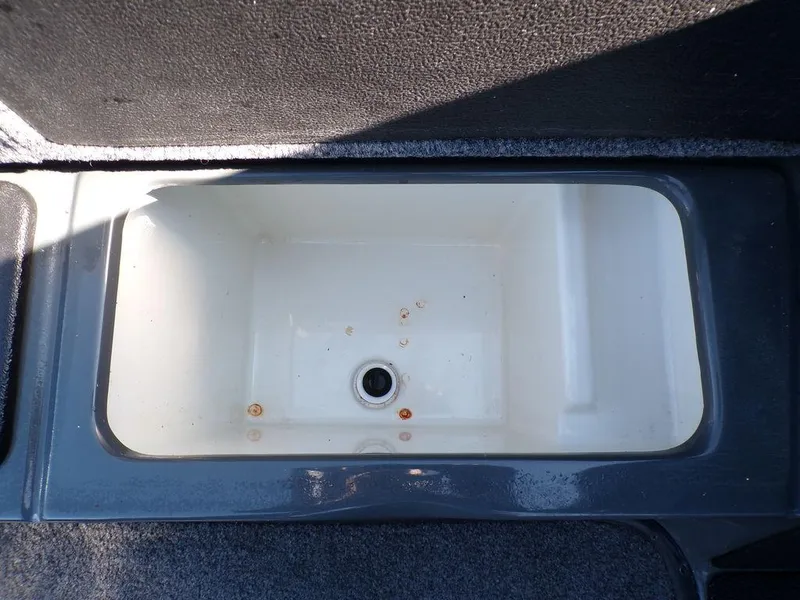 Slide: The Image of 2023 Phoenix 920 Elite boat livewell with drain. - 31