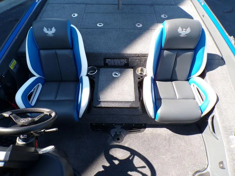 Slide: The Image of 2023 Phoenix 920 Elite boat interior with dual blue and white seats. - 33