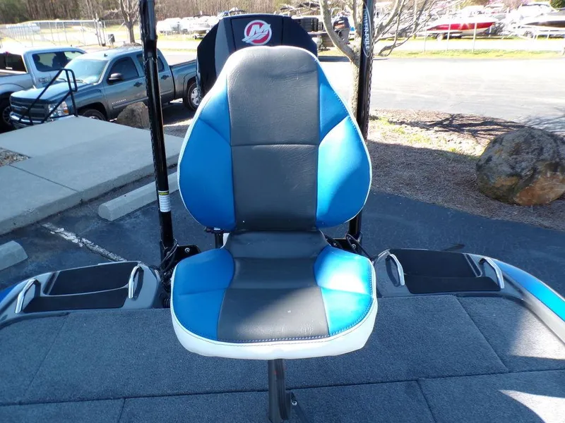 Slide: The Image of Phoenix 920 Elite 2023 boat seat with blue and black upholstery. - 37