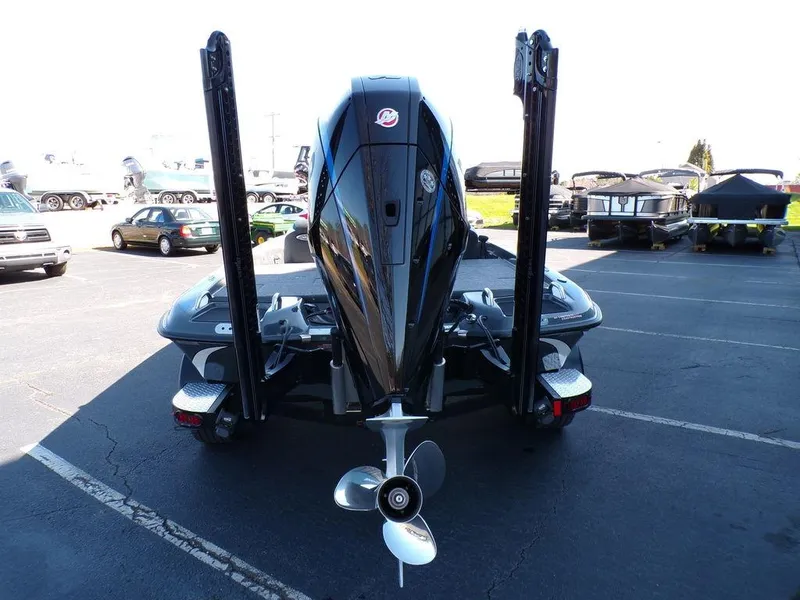 Slide: The Image of 2023 Phoenix 920 Elite boat rear view with outboard motor and dual power poles. - 6