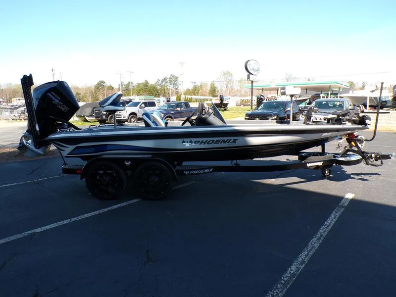 Slide: The Image of 2023 Phoenix 920 Elite boat on a trailer in a parking lot. - 9