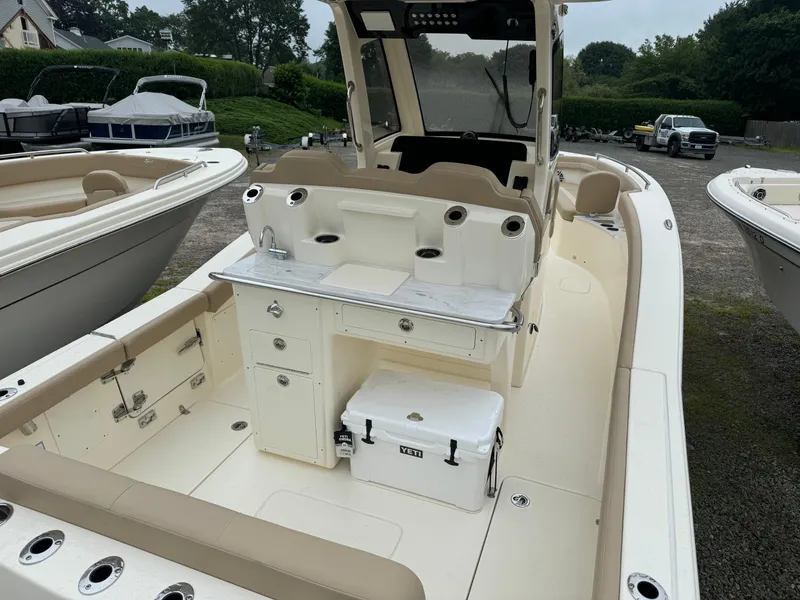 Slide: The Image of 2025 Scout 260 LXF boat interior with seating and storage compartments. - 12