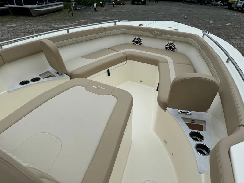 Slide: The Image of 2025 Scout 260 LXF boat interior with beige and white seating. - 19
