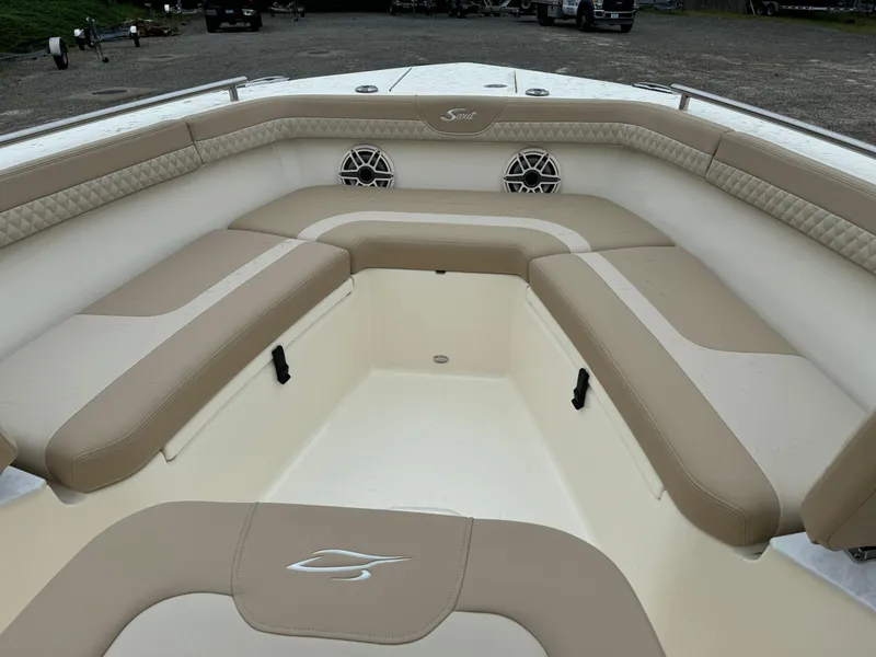 Slide: The Image of 2025 Scout 260 LXF boat interior with beige and white seating. - 20