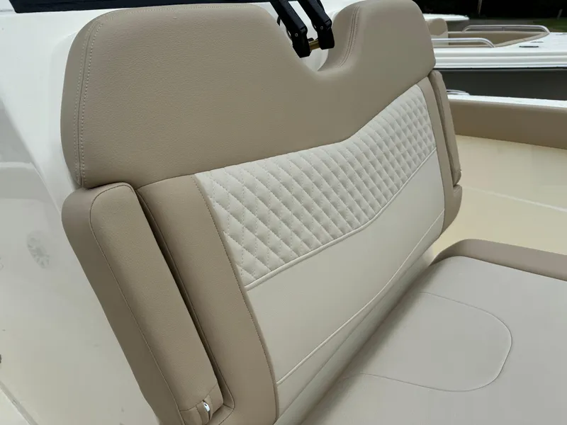 Slide: The Image of 2025 Scout 260 LXF boat seat with beige and white upholstery. - 23