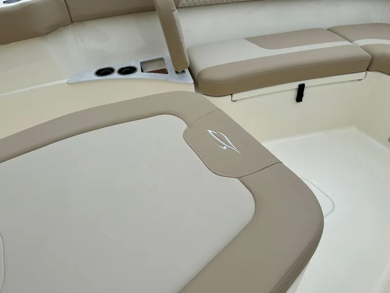 Slide: The Image of 2025 Scout 260 LXF boat interior with beige and cream seating. - 24