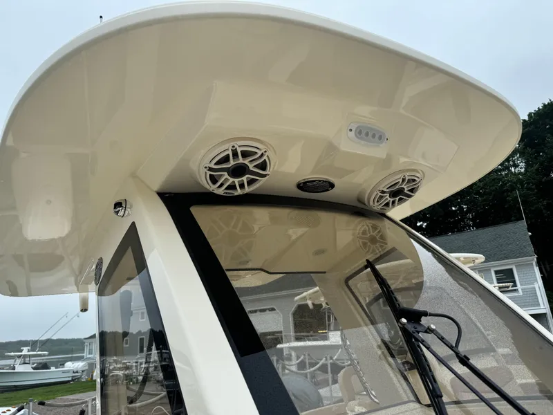 Slide: The Image of 2025 Scout 260 LXF boat with advanced audio system and sleek design. - 25