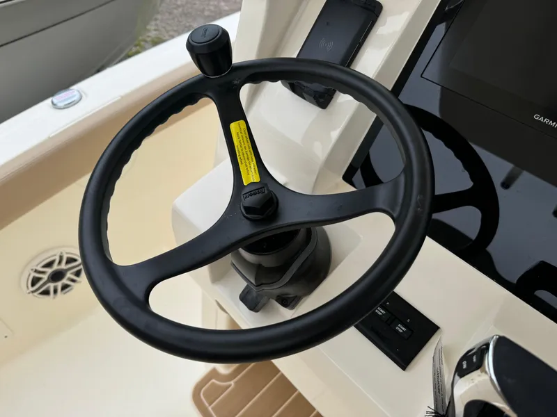 Slide: The Image of Steering wheel of 2025 Scout 260 LXF boat with control panel. - 29