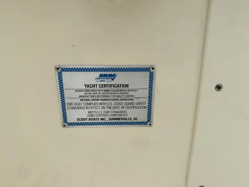 Slide: The Image of 2025 Scout 260 LXF yacht certification plate, U.S. Coast Guard safety standards compliance. - 33