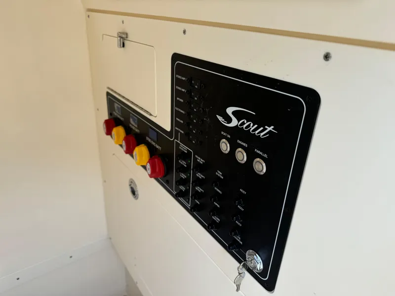 Slide: The Image of Control panel of 2025 Scout 260 LXF boat with switches and indicators. - 39