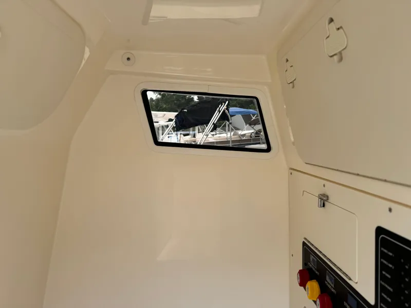 Slide: The Image of Interior cabin of 2025 Scout 260 LXF boat with window and control panel. - 40