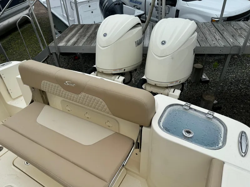 Slide: The Image of 2025 Scout 260 LXF boat with twin Yamaha outboard engines and beige seating. - 45