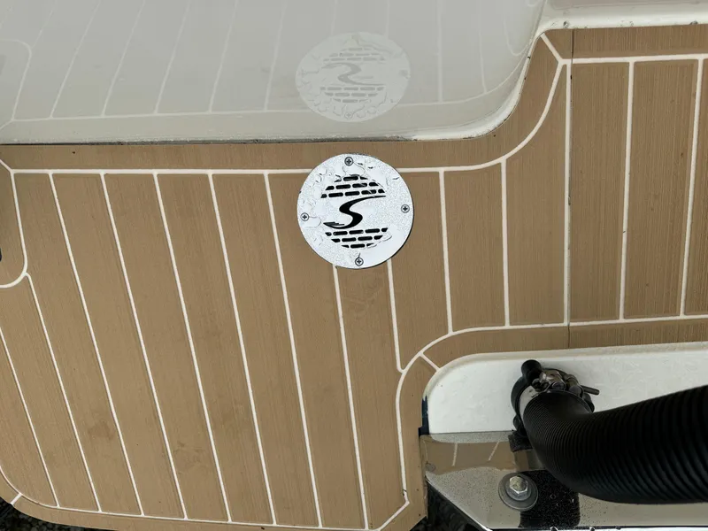 Slide: The Image of 2025 Scout 260 LXF boat deck with logo and wood finish. - 47