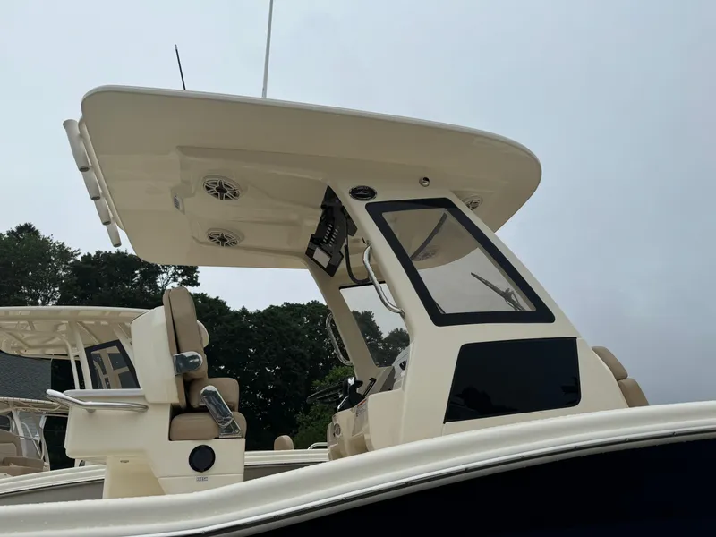 Slide: The Image of 2025 Scout 260 LXF boat with modern helm and T-top. - 7