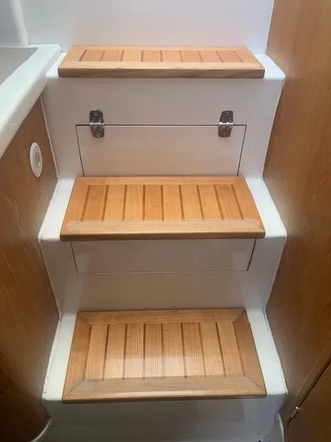 Slide: The Image of Wooden steps inside a 2004 Stolper 38 boat. - 15