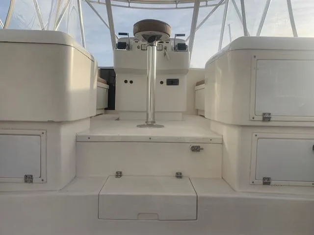 Slide: The Image of Stolper 38 boat interior, 2004 model, featuring helm station and seating area. - 17