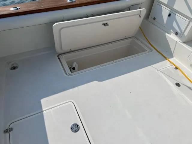 Slide: The Image of Open storage compartment on a 2004 Stolper 38 boat deck. - 21