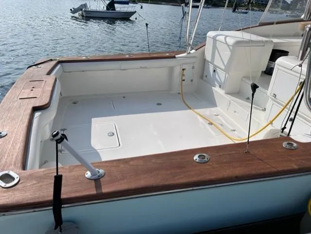 Slide: The Image of Stolper 38 boat deck, 2004 model, with wooden trim and spacious layout. - 22