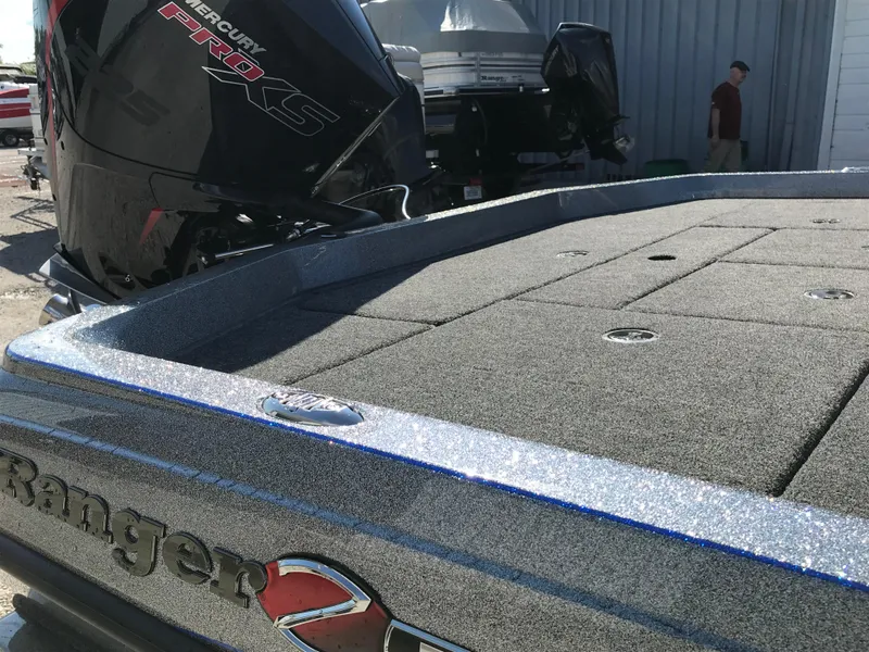 Slide: The Image of 2024 Ranger Z519 boat interior with blue and black seats. - 10