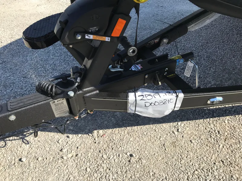 Slide: The Image of 2024 Ranger Z519 boat on a trailer outside a metal building. - 15