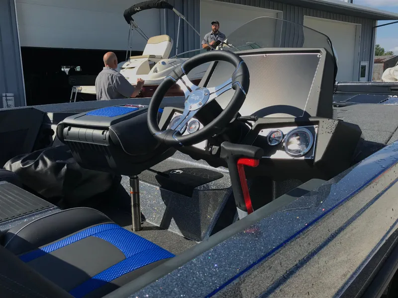 Slide: The Image of 2024 Ranger Z519 boat trailer hitch and step on gravel. - 7