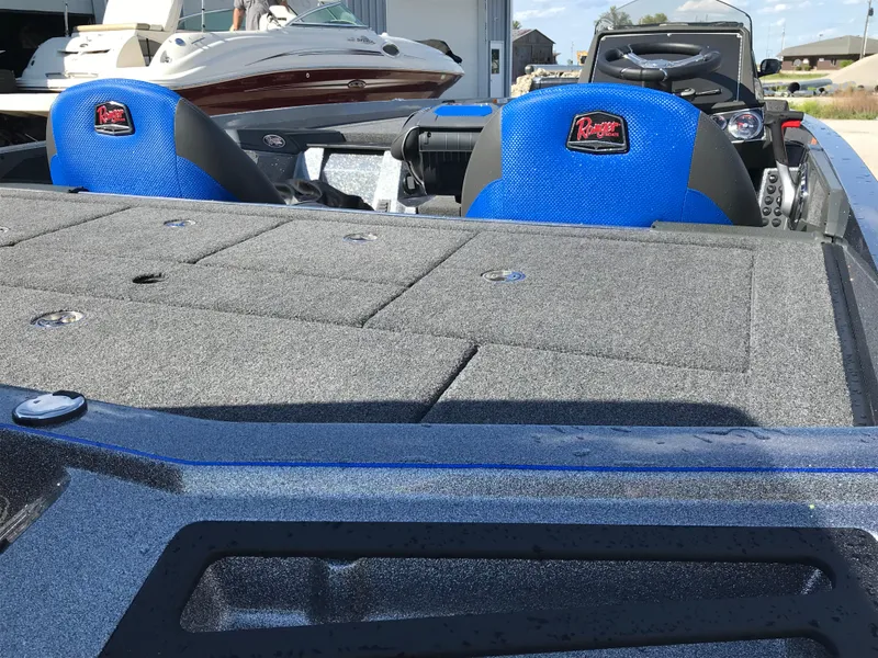 Slide: The Image of 2024 Ranger Z519 boat interior with steering wheel and dashboard. - 8