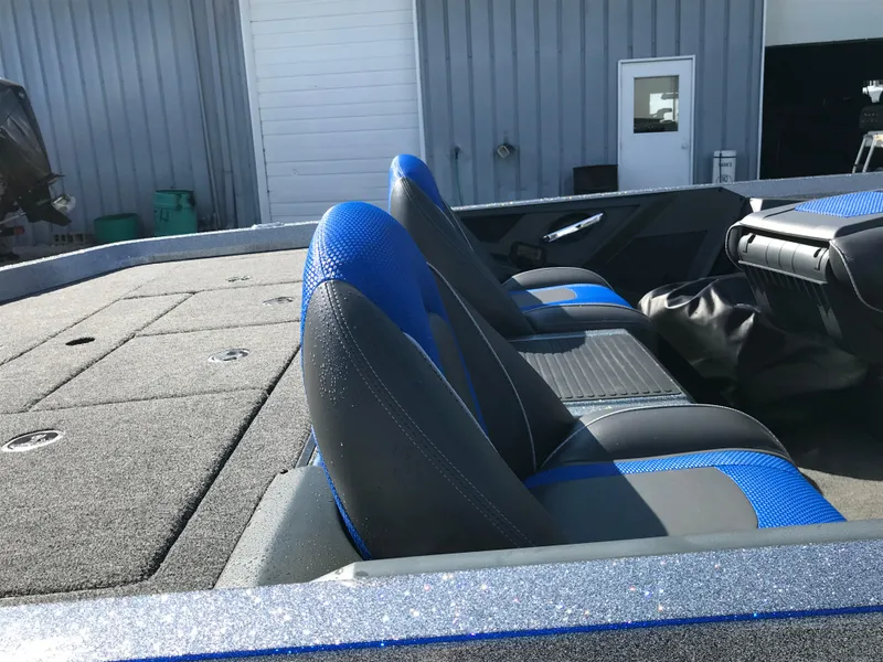 Slide: The Image of 2024 Ranger Z519 boat with blue seats and spacious deck. - 9