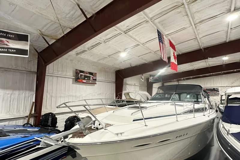 The Image of 1986 Sea Ray 390 Express yacht in indoor storage facility. - 0