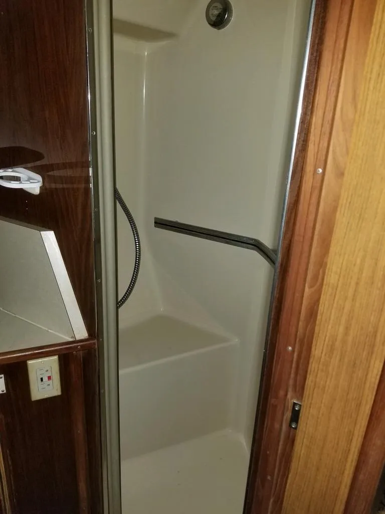 Slide: The Image of Shower area in 1986 Sea Ray 390 Express boat. - 10