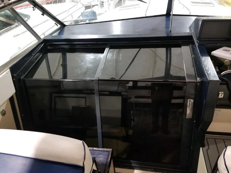 Slide: The Image of 1986 Sea Ray 390 Express cabin entrance with sliding glass doors. - 22